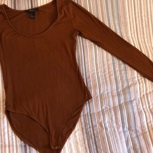 Dark orange bodysuit.